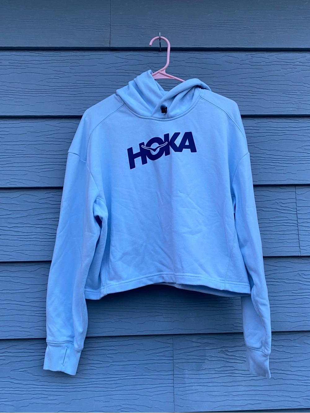 Woman’s Hoka Powder Blue Cropped Hoodie with Navy Logo
